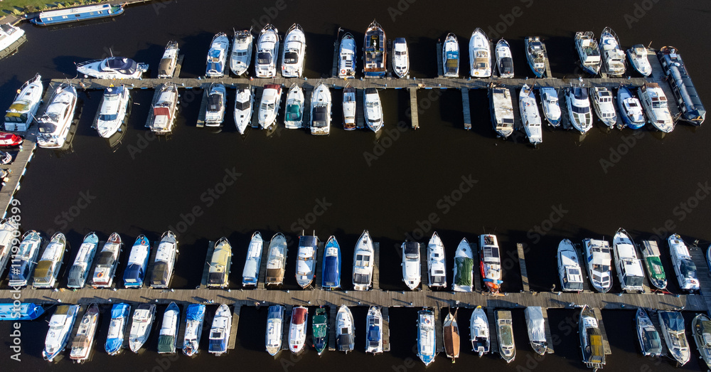 Aerial view of small boats moored at marina Aerial view of small boats moored at marina