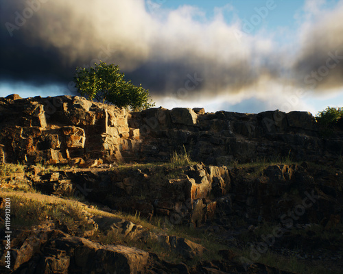 Obraz na płótnie Quarry slate with vegetation under a cloudy sky. 3D render. w salonie