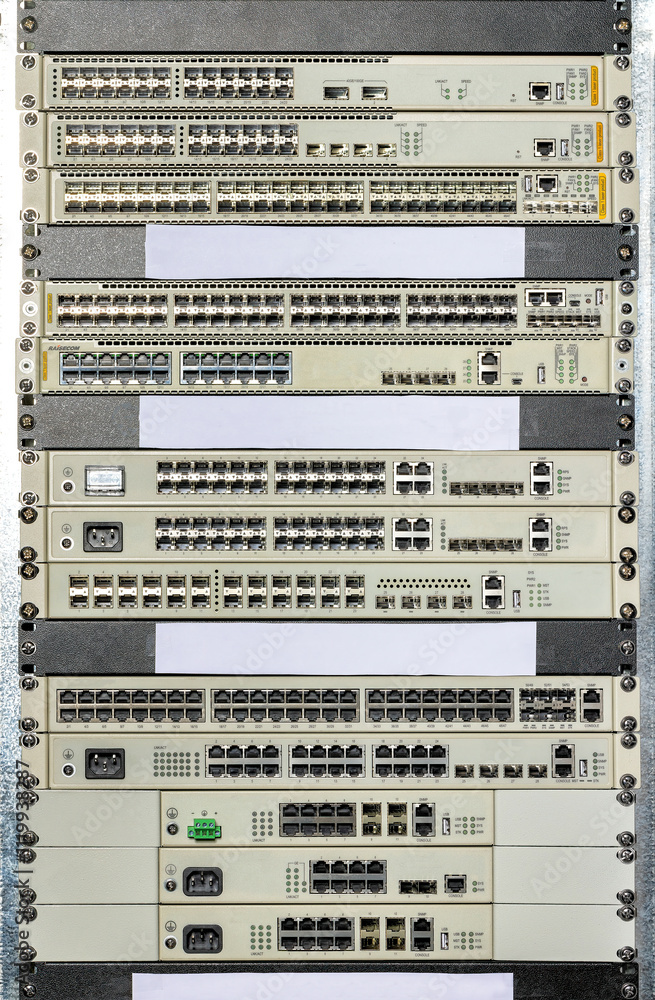 Network switches and routers stacked in a data center view showcasing connectivity technology