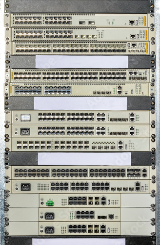 Obraz na płótnie Network switches and routers stacked in a data center view showcasing connectivity technology w salonie