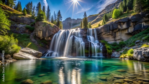 Scenic view of a majestic waterfall in full force surrounded by lush greenery and sunlit rocks photo