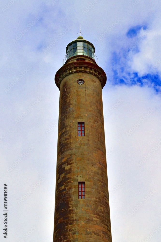 view of the historic lighthouse located on the promenade of Maspalomas on the island of Gran Canaria in Spain view of the historic lighthouse located on the promenade of Maspalomas on the island of Gran Canaria in Spain