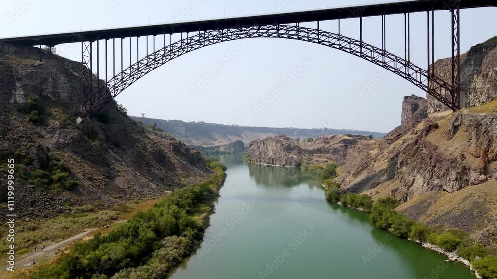 Aerial view of the Perrine Memorial Bridge over the snake river in Twin Falls, Idaho. With cars driving across the bridge. Aerial view of the Perrine Memorial Bridge over the snake river in Twin Falls, Idaho. With cars driving across the bridge.