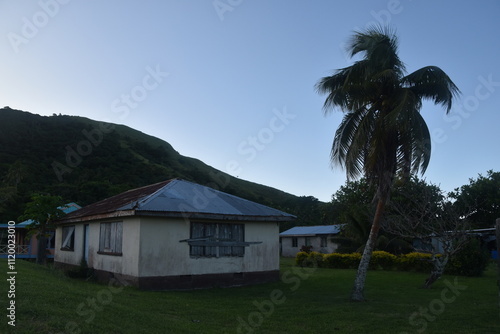 Local poor basic homes in a remote local village on a Pacific Island in Fiji photo