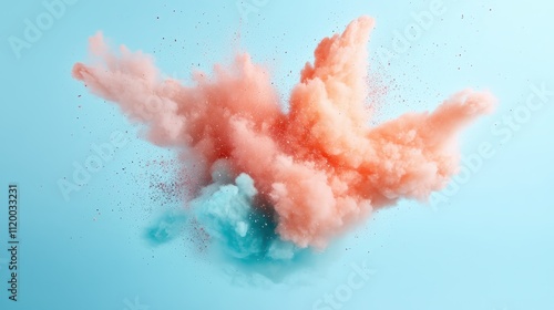 A stunning capture of orange and blue powders exploding in mid-air, set against a teal backdrop, symbolizing creativity and dynamic movement in art form. photo