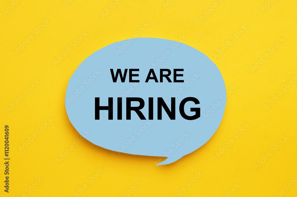 Paper note with text We Are Hiring on yellow background, top view. Human resource Paper note with text We Are Hiring on yellow background, top view. Human resource