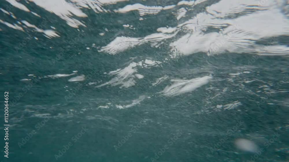 Ocean Waves During Storm. Harsh strong stormy waves make foam in open water of Pacific Ocean. Bad windy dangerous weather with grey cloudy sky. Extreme conditions for swimming. Powerful nature concept Ocean Waves During Storm. Harsh strong stormy waves make foam in open water of Pacific Ocean. Bad windy dangerous weather with grey cloudy sky. Extreme conditions for swimming. Powerful nature concept