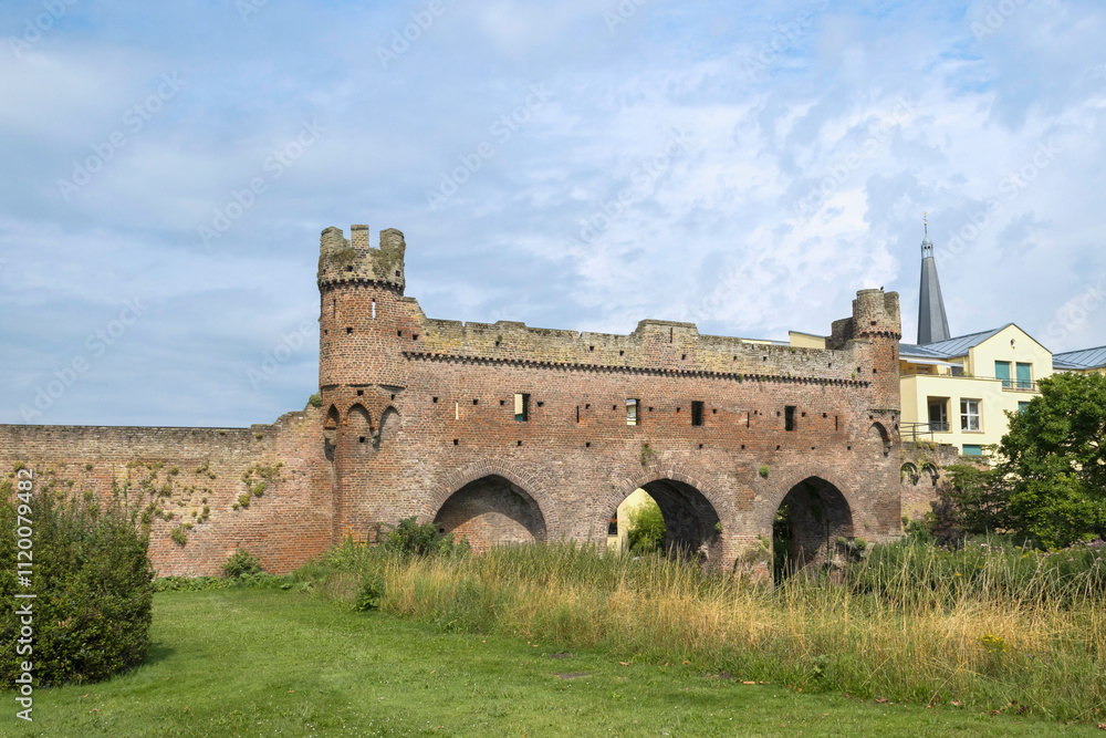 Berkelpoort – a 14th-century watergate built into the city wall crossing the Berkel River in the Hanseatic town of Zutphen, Netherlands. Berkelpoort – a 14th-century watergate built into the city wall crossing the Berkel River in the Hanseatic town of Zutphen, Netherlands.