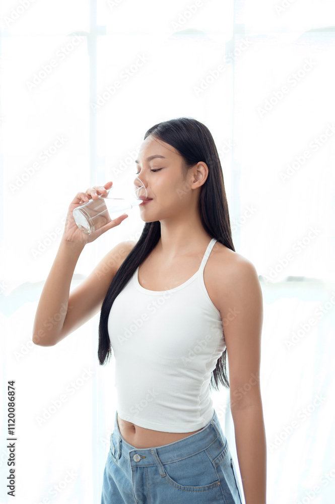 Young asian woman drinking water bedroom at home Young asian woman drinking water bedroom at home
