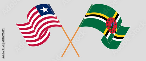 Crossed and waving flags of Liberia and Dominica. Vector illustration