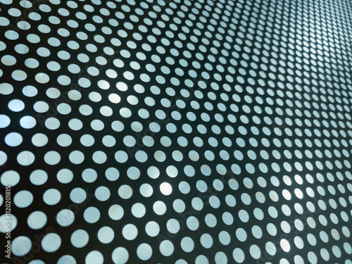 Abstract Perforated metal panel with circular holes forming a geometric and abstract pattern. Ideal for industrial, modern, or architectural designs with a clean and symmetrical aesthetic.