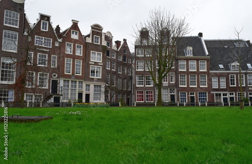 The Begijnhof is one of the oldest hofjes in Amsterdam, Netherlands. A group of historic buildings, mostly private dwellings, centre on it. photo