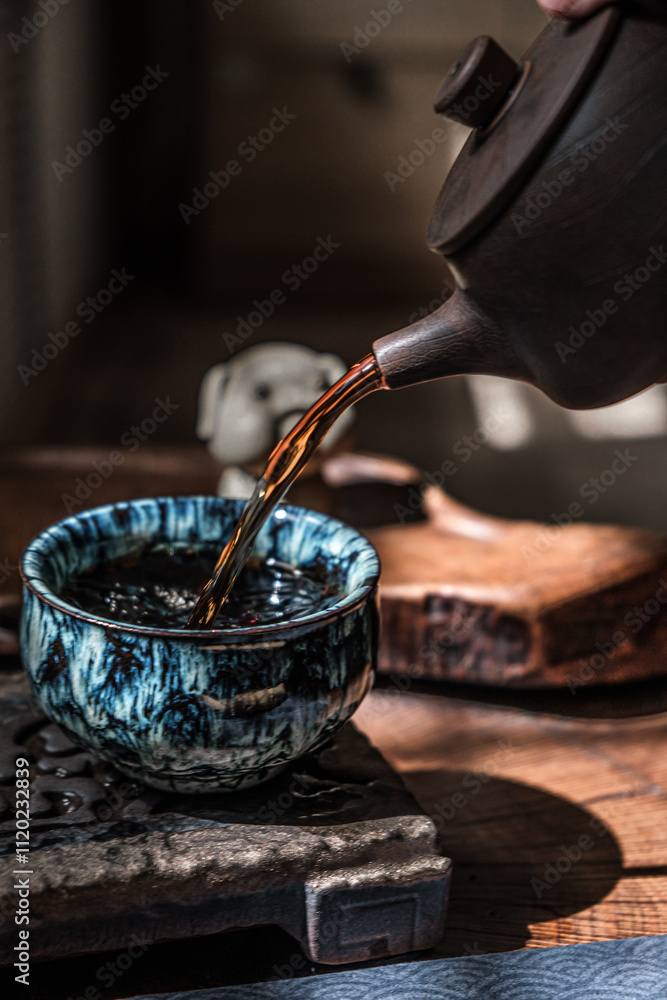 Artisan tea poured into a beautiful ceramic cup, creating an inviting atmosphere