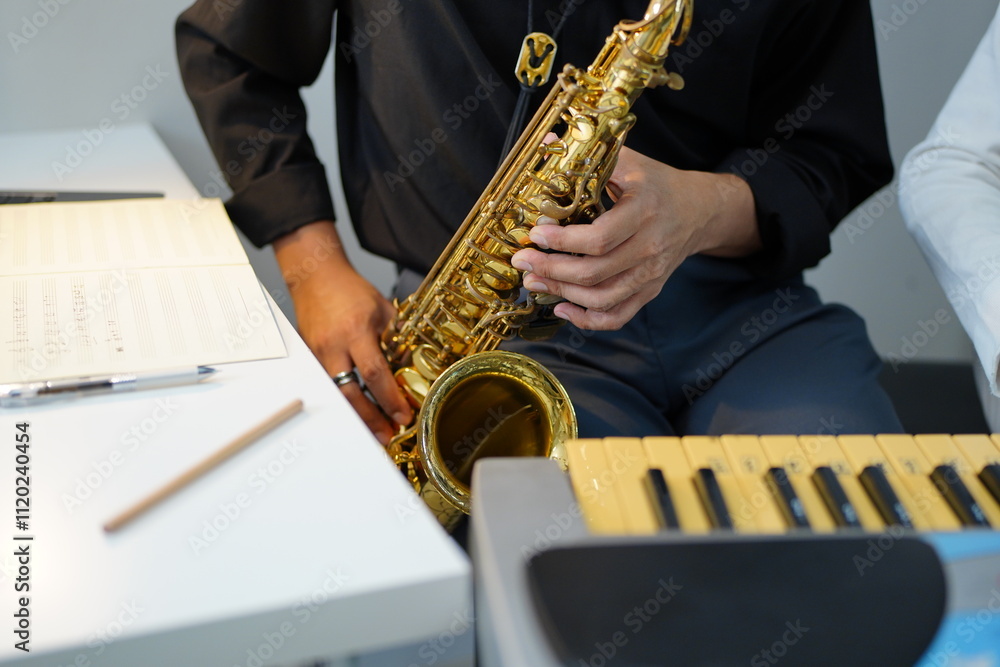 Naklejka premium Working Asians are learning international musical skills at home