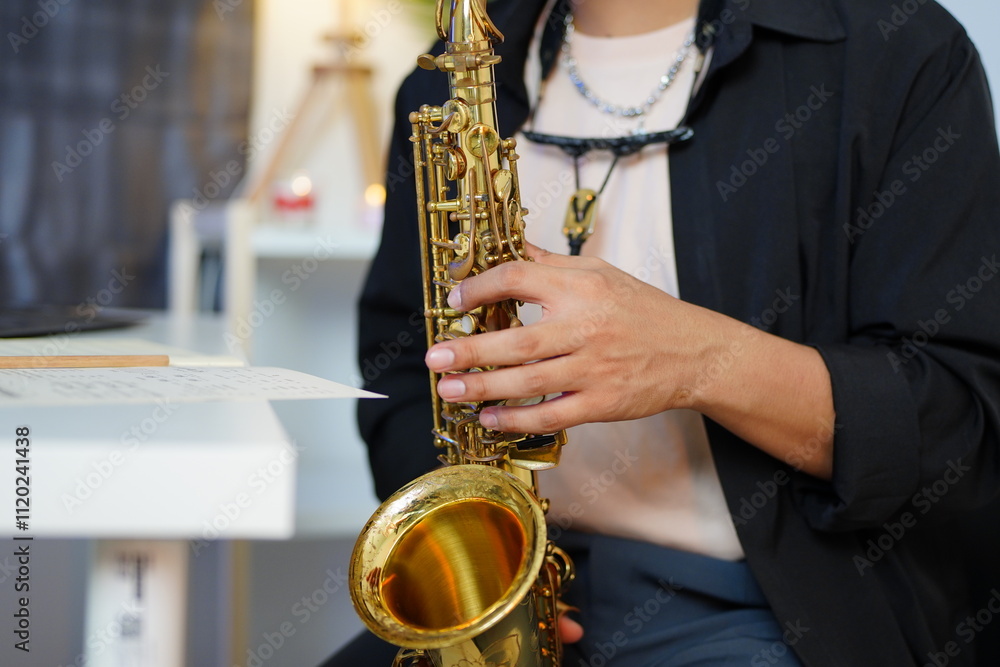 Naklejka premium Working Asians are learning international musical skills at home