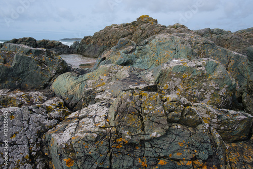 Pillow lava, Newborough Sands, Wales.  Basaltic pillow lava formed from underwater volcanic activity between 500 and 600 million years ago photo