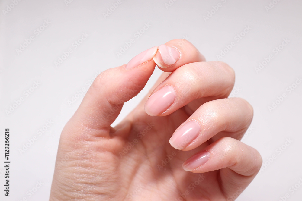 Bad manicure. Peeling gel nail polish on woman nails. Bad manicure. Peeling gel nail polish on woman nails.