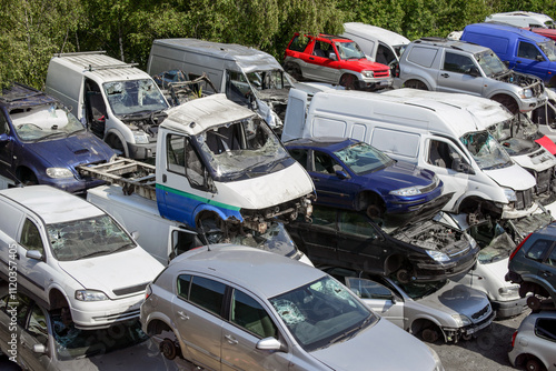 Tablou pe pânză Accident damaged cars and vans at salvage yard