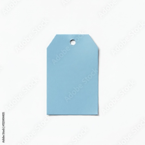 Minimalistic blue blank price tag with string on white surface for branding, sales, advertising, merchandise, and creative design concepts. photo