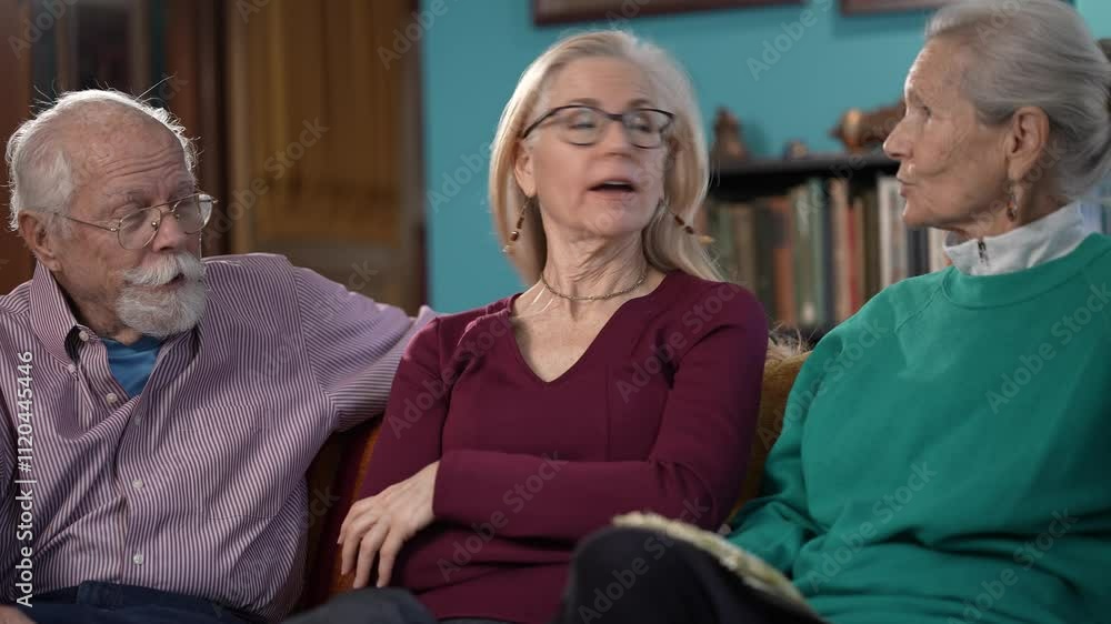Three family members share a lively conversation in a vibrant living room, filled with warmth and laughter, highlighting their close bond and togetherness. Three family members share a lively conversation in a vibrant living room, filled with warmth and laughter, highlighting their close bond and togetherness.