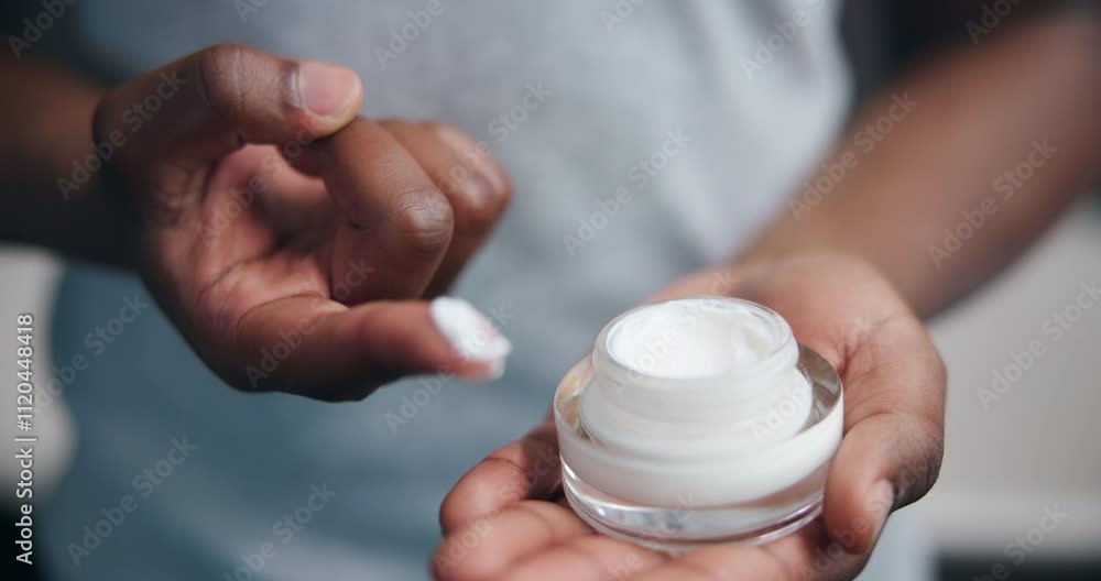 Cream, finger and product with person in bathroom of home for morning beauty or skincare routine. Container, lotion and moisturizer with antiaging treatment closeup in apartment for dermatology Cream, finger and product with person in bathroom of home for morning beauty or skincare routine. Container, lotion and moisturizer with antiaging treatment closeup in apartment for dermatology