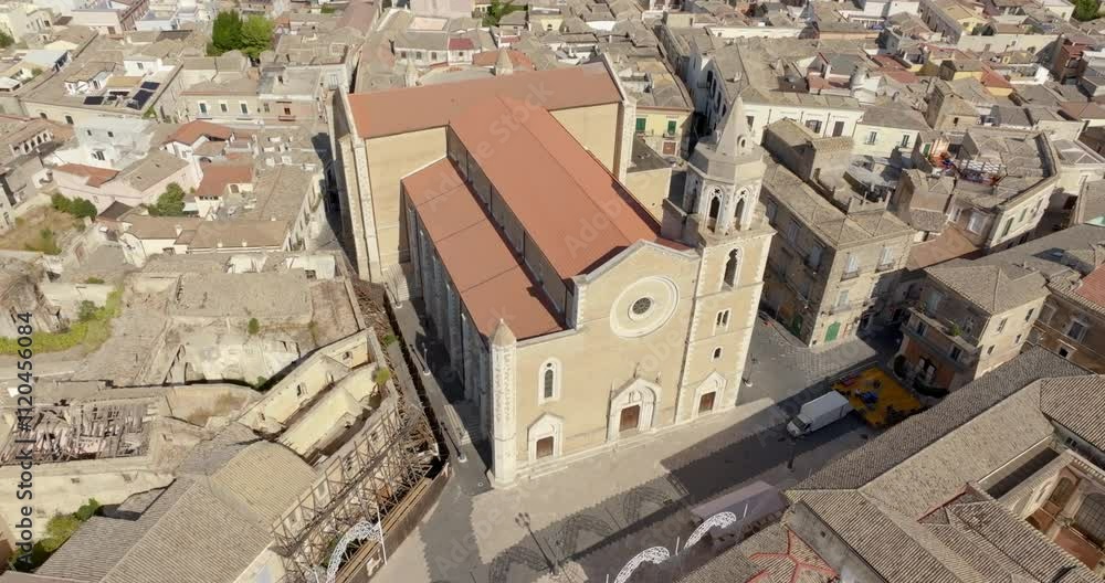 Aerial view of the Basilica of Santa Maria Assunta in the historic center of Lucera, in province of Foggia, Puglia, Italy. The cathedral of the town is dedicated to the Assumption of the Virgin Mary. Aerial view of the Basilica of Santa Maria Assunta in the historic center of Lucera, in province of Foggia, Puglia, Italy. The cathedral of the town is dedicated to the Assumption of the Virgin Mary.