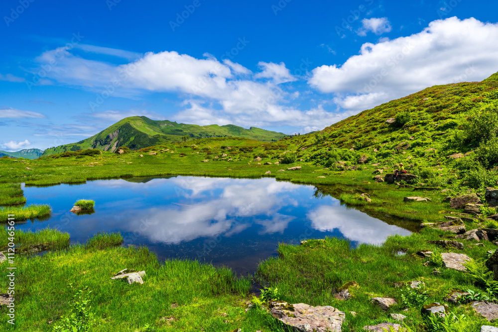 Small Lake on the way form Alpe Portla to Alpe Gävis in the Mellental, Region of Bregenzerwald Valley, State of Vorarlberg, Austria Small Lake on the way form Alpe Portla to Alpe Gävis in the Mellental, Region of Bregenzerwald Valley, State of Vorarlberg, Austria