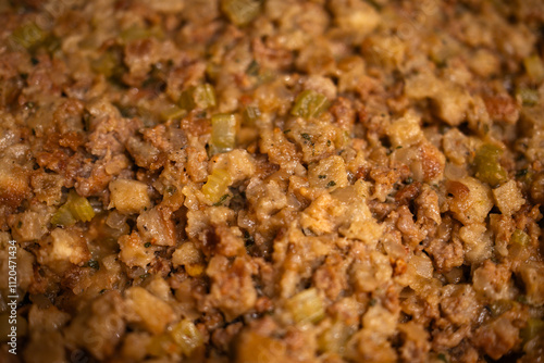 close-up of Thanksgiving stuffing with sausage, onions, and celery; Thanks giving food background