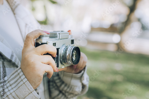 Tourist girl taking pictures of nature with her camera, photo