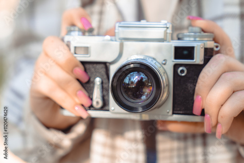 Tourist girl taking pictures of nature with her camera, photo