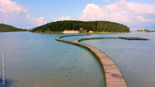 Wallpaper Mural 4k drone forward video (Ultra High Definition) of empty wooden pier to St Mary's Monastery. Wonderful summer seascape of Adriatic sea. Splendid landscape of Narta Lagoon. Albania, Europe. Torontodigital.ca