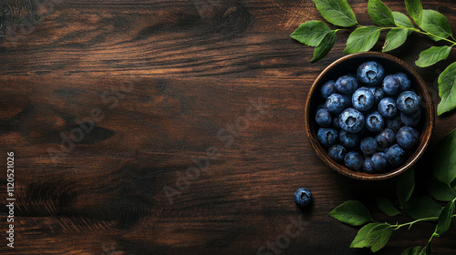  Fresh and Delicious: Bowl of Blueberries with Green Leaves