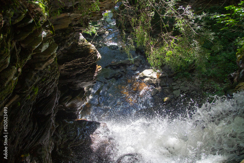 waterfall in the mountains from above photo