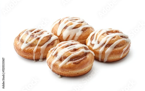 Cinnamon rolls with icing dripping down the sides on white background