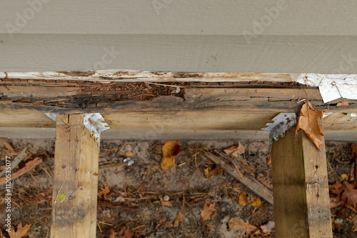 Deck Ledger Board Incorrectly Installed over Wood Siding has led to Extensive Dry Rot and Damage