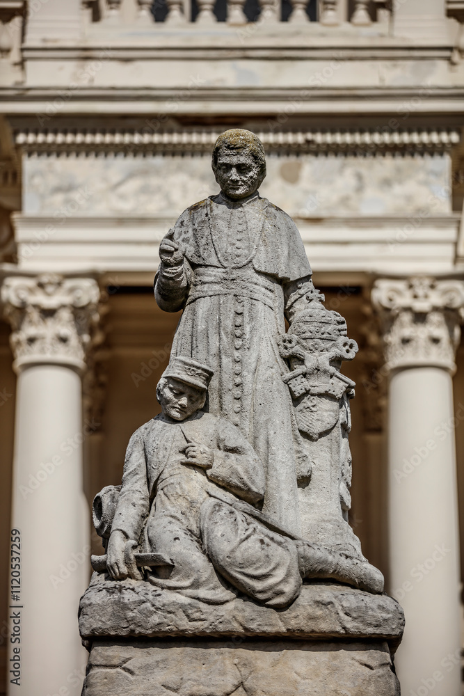 Large stone monument depicts a bishop and a soldier, likely a memorial. Detailed carving on a pedestal. Large stone monument depicts a bishop and a soldier, likely a memorial. Detailed carving on a pedestal.