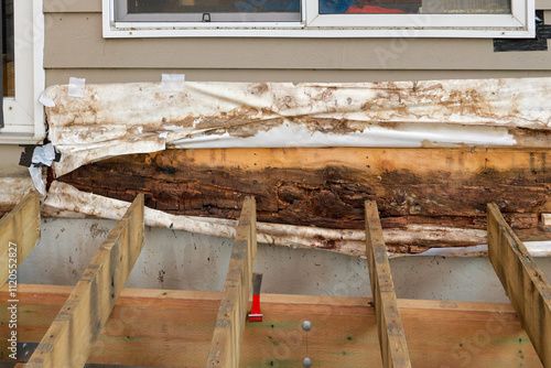 Removed Deck Ledger Board Reveals Dry Rotten Rim Joist Board with Extensive Damage on House
