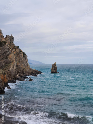 Sea and stones majestic raging sea with splashes and gusts of wind in blue color for your purposes and covers