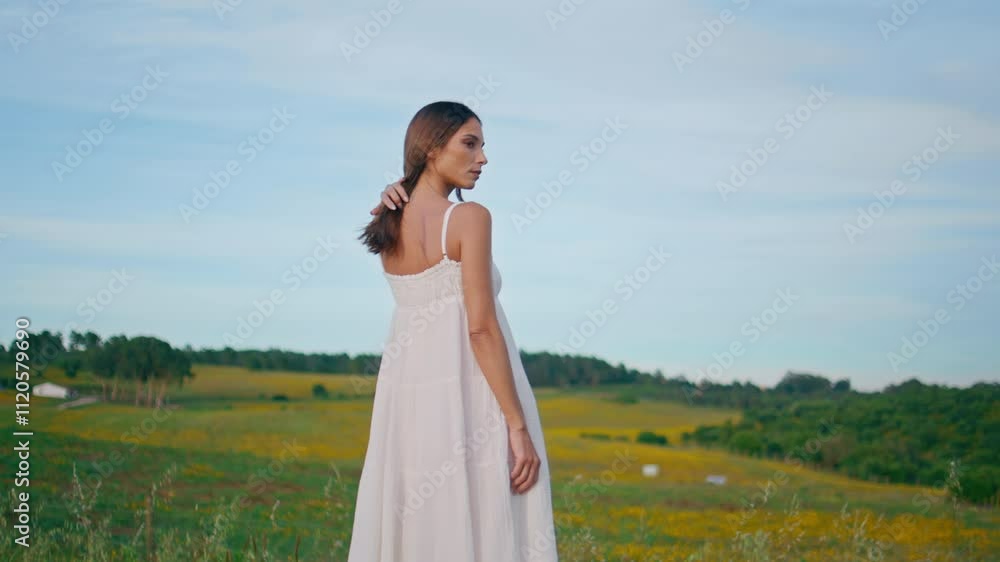 Romantic woman contemplating pasture enjoying nature back view. Girl posing Romantic woman contemplating pasture enjoying nature back view. Girl posing