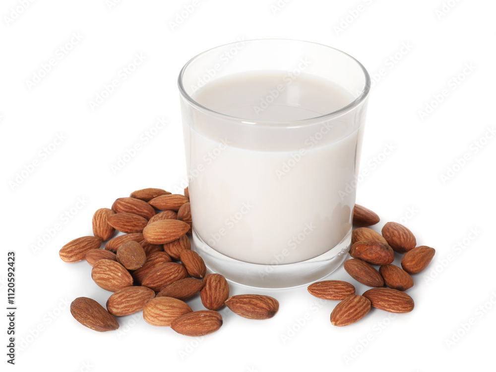 Glass of almond milk and nuts isolated on white Glass of almond milk and nuts isolated on white