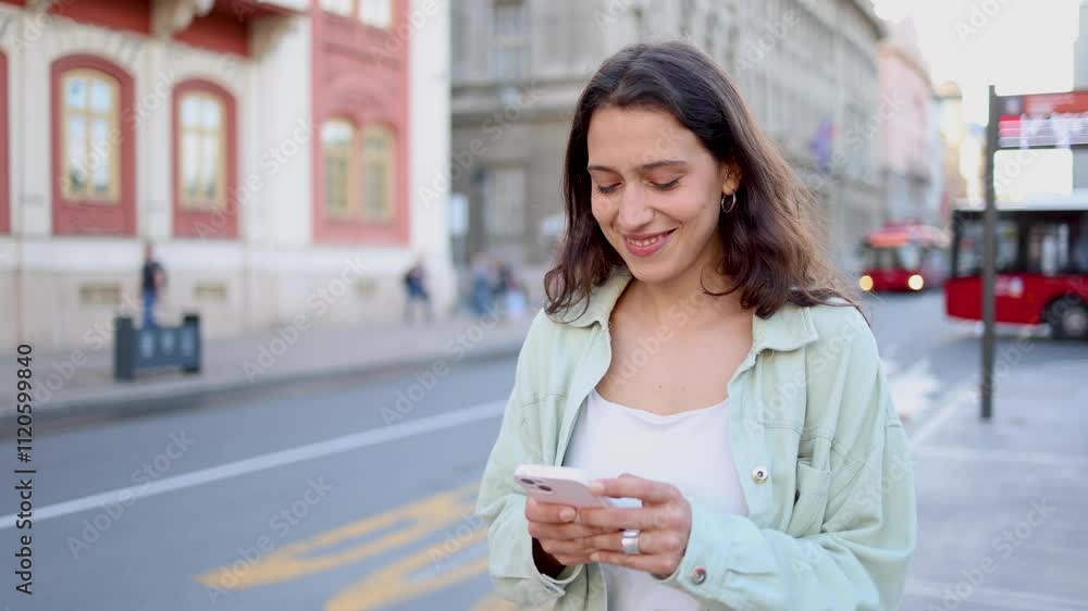 Beautiful, young woman enjoying in the city and using smartphone Beautiful, young woman enjoying in the city and using smartphone