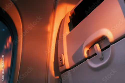 Close-up of the interior of the seat during sunset, air travel, seat details, relaxing on board photo