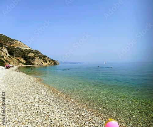 Kakia skala pebble beach. Calm crystal clear waters. A hidden gem near Athens. photo