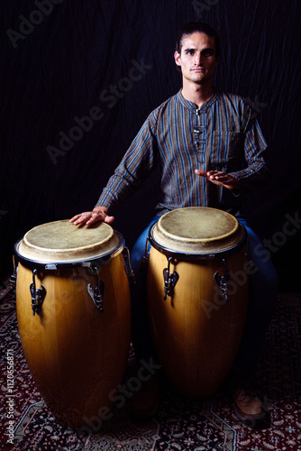 Fotografie Full-Body Portrait of Percussionist Playing Congas