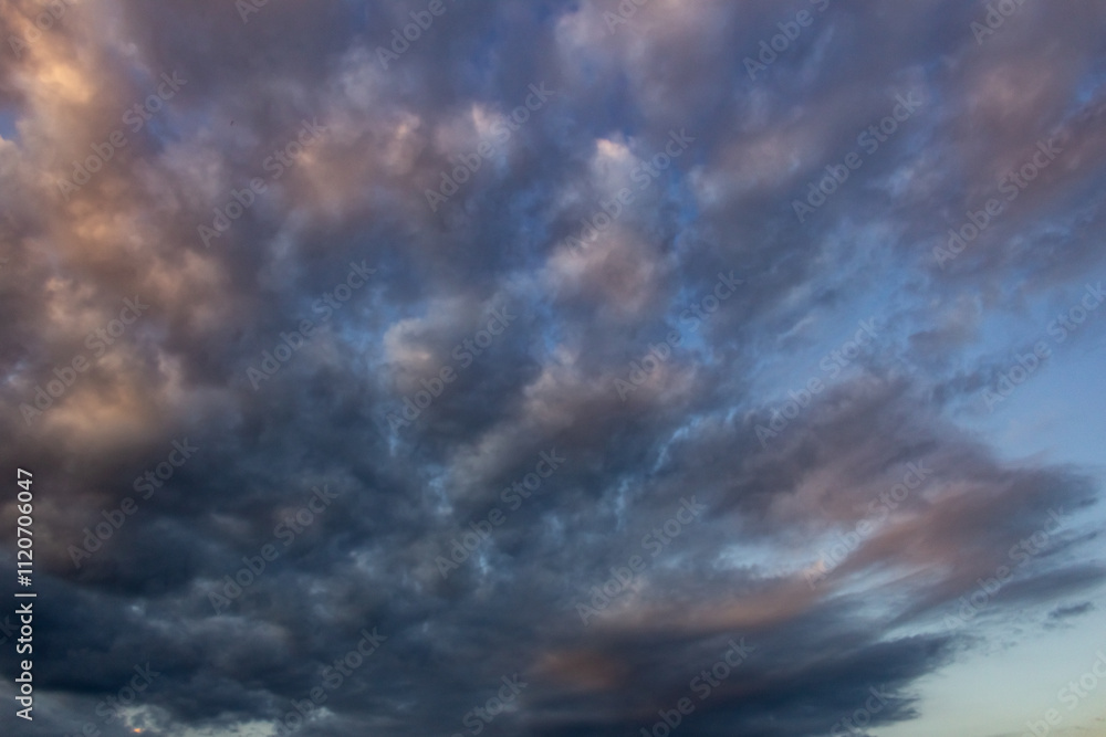 Dramatic sky with stormy clouds at sunset. Nature background Dramatic sky with stormy clouds at sunset. Nature background