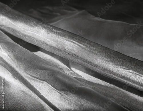 folds and tears of fabric as a dark texture as a background