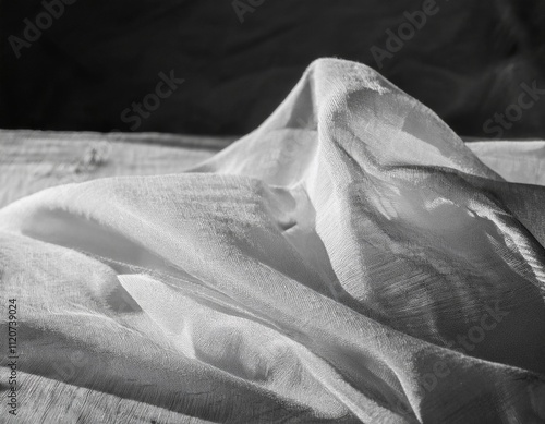 folds and tears of fabric as a dark texture as a background