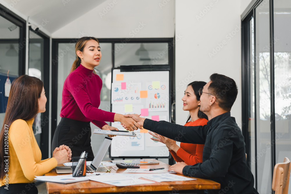 team collaborating in modern office with handshake team collaborating in modern office with handshake