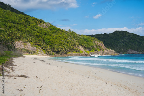 Beautiful isolated white sandy of police bay, turquoise water, lush vegetation, Mahe, Seychelles