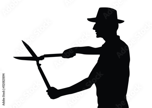 Silhouette of a man using hedge shears